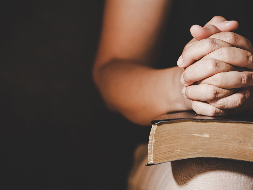 when your husband struggles spiritually a woman prays alone with her bible