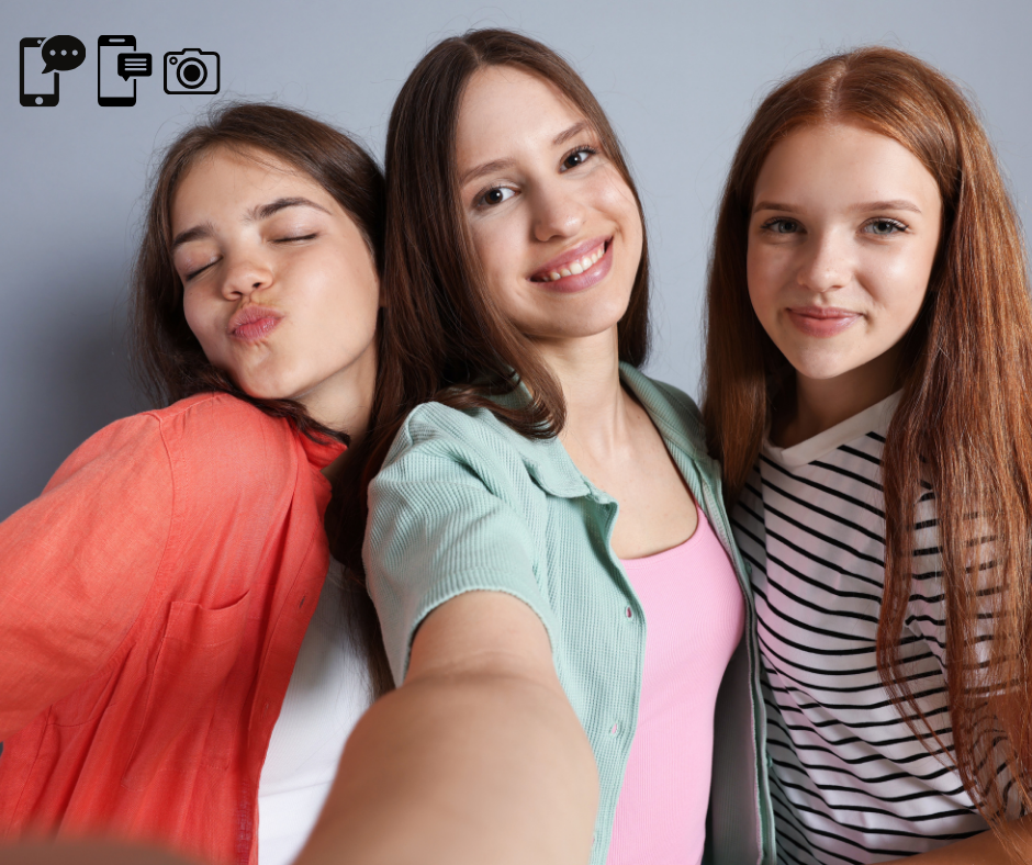 three middle school girls taking a photo being girl bullies in middle school